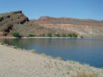 More is Required To Solve Southern Utah’s Water Challenges View across the reservoir toward surrounding mountains on Quail Creek Overlook Trail, Quail Creek State Park, April 2024 - Photo by Tom Garrison